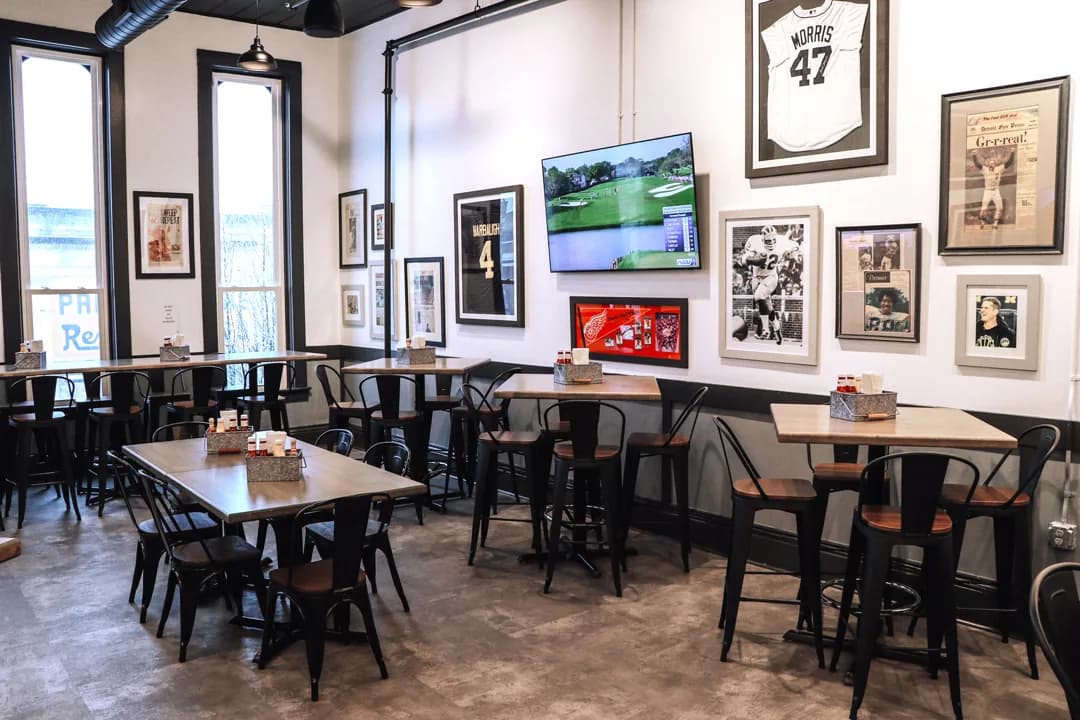 The east wall of the Copper Reserve, lined with framed sports photography